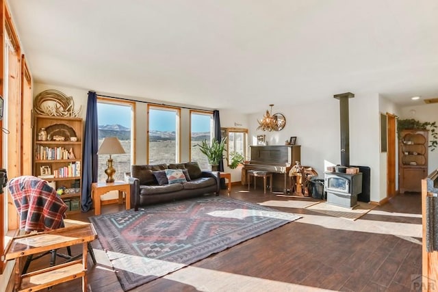 living area with light wood-type flooring and a wood stove