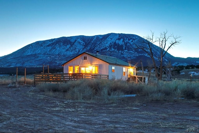 rear view of house with a mountain view