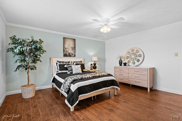 bedroom with ceiling fan, ornamental molding, dark wood finished floors, and baseboards