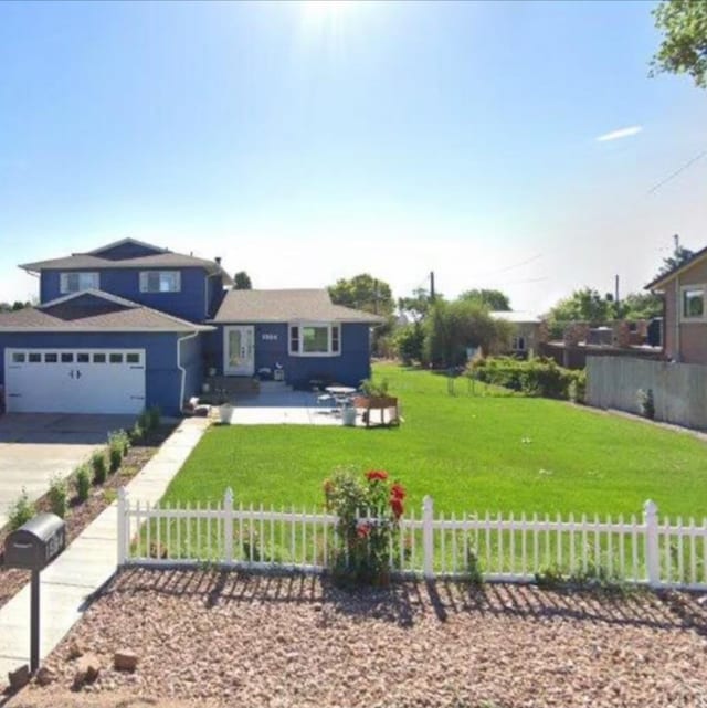 view of front of home featuring an attached garage, a fenced front yard, concrete driveway, and a front yard