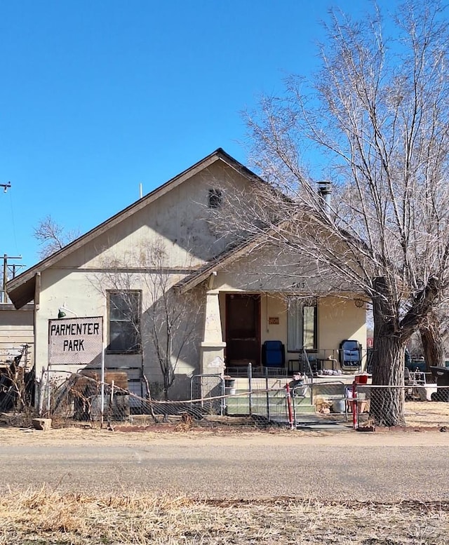 view of building exterior featuring fence