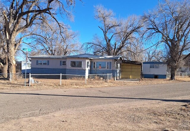 manufactured / mobile home with a fenced front yard