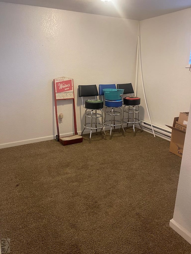 recreation room featuring carpet and baseboards