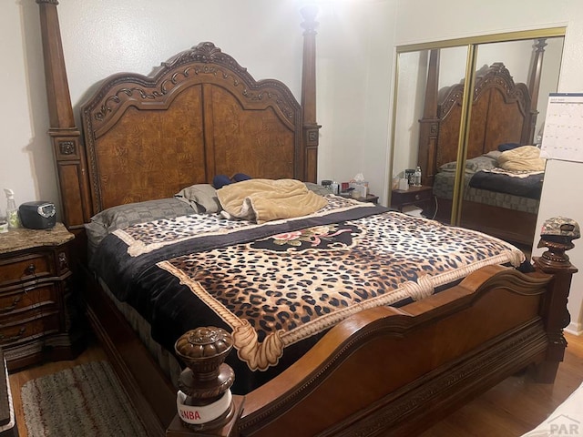 bedroom with a closet and wood finished floors