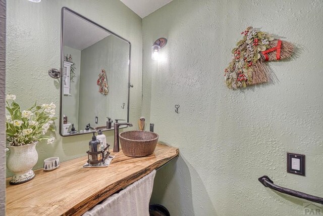 4701 County Rd 323, Westcliffe, CO 81252 - bathroom with vanity and a textured wall