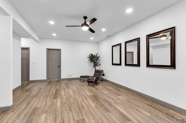 unfurnished room with recessed lighting, visible vents, light wood-style flooring, ceiling fan, and baseboards