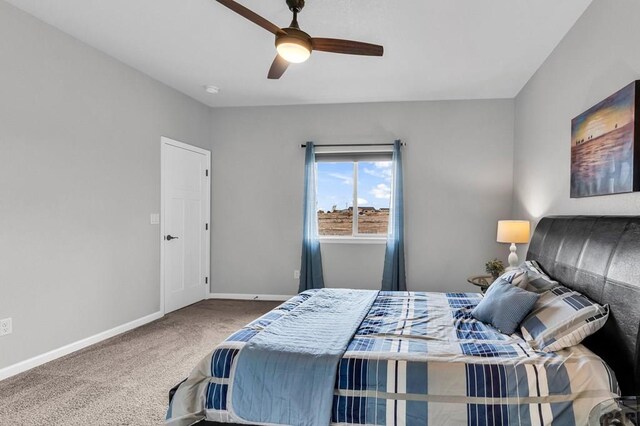 bedroom featuring carpet, baseboards, and a ceiling fan