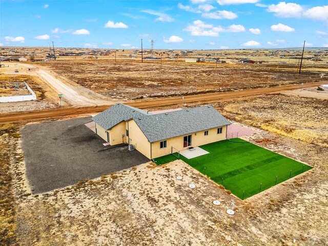 birds eye view of property with a rural view