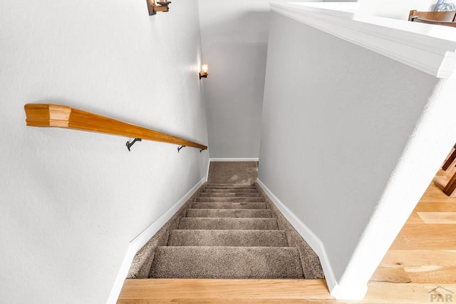 stairs with carpet and baseboards