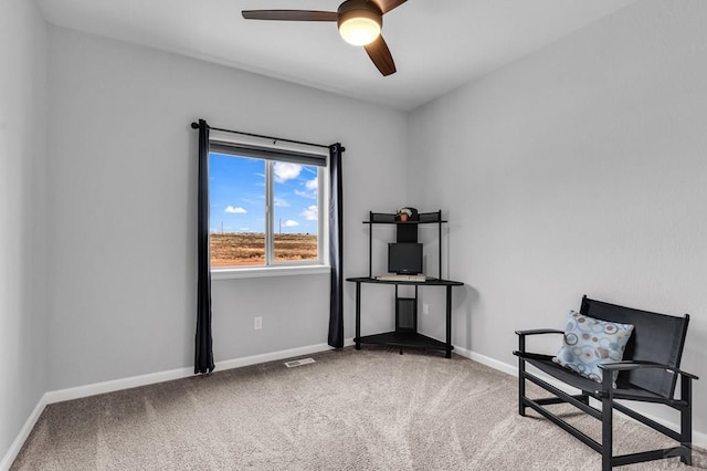 unfurnished room with visible vents, carpet floors, a ceiling fan, and baseboards