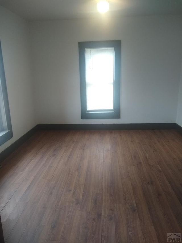 118 S 1st St, Cheraw, CO 81030 - empty room with dark wood-style flooring and baseboards