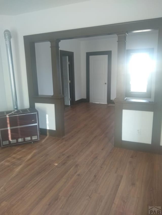 118 S 1st St, Cheraw, CO 81030 - spare room featuring decorative columns and wood finished floors