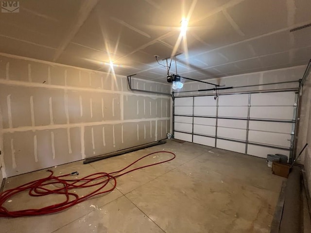 garage featuring a garage door opener