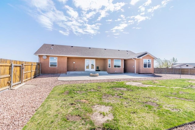 back of house with a patio area, a fenced backyard, french doors, and stucco siding