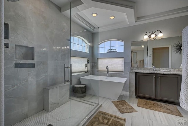 10919 Cascading Spring Cir, Peyton, CO 80831 - bathroom featuring a stall shower, a freestanding bath, coffered ceiling, vanity, and recessed lighting