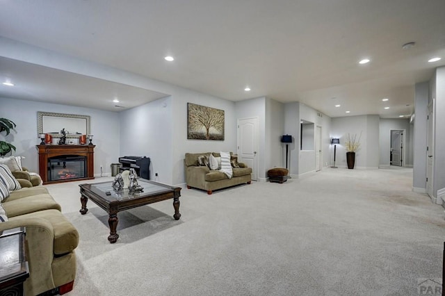 10919 Cascading Spring Cir, Peyton, CO 80831 - living room featuring recessed lighting, light carpet, a glass covered fireplace, and baseboards