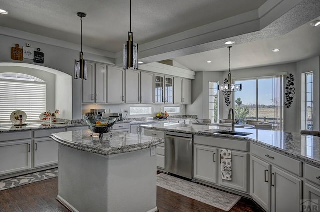 10919 Cascading Spring Cir, Peyton, CO 80831 - kitchen featuring dishwasher, a sink, dark wood finished floors, a center island, and recessed lighting