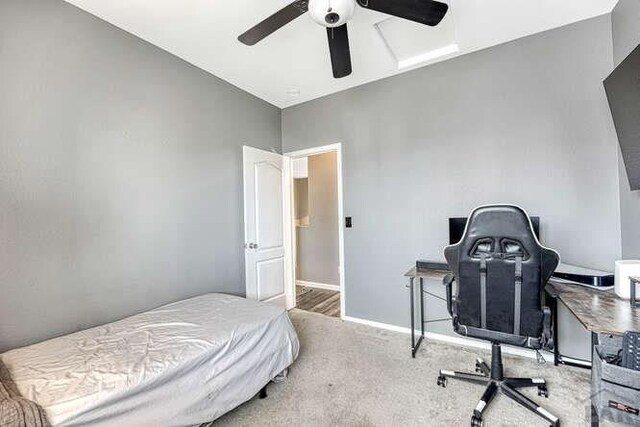 bedroom featuring carpet, a ceiling fan, and baseboards