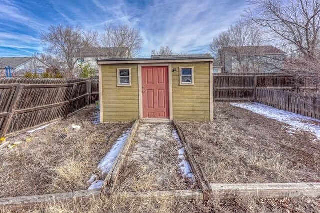 view of shed with a fenced backyard