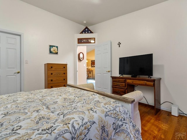 bedroom with wood finished floors