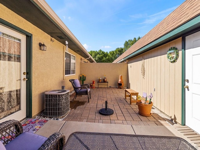 view of patio / terrace with fence and central AC unit