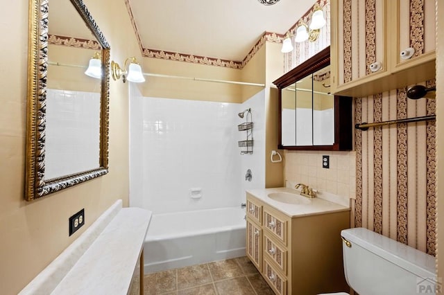 full bathroom with toilet, decorative backsplash, bathtub / shower combination, tile patterned floors, and vanity