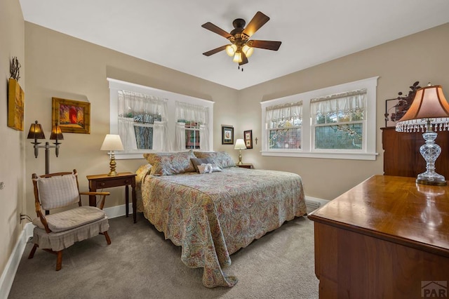 bedroom featuring carpet flooring, baseboards, and a ceiling fan