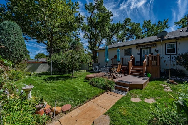 view of yard with a wooden deck