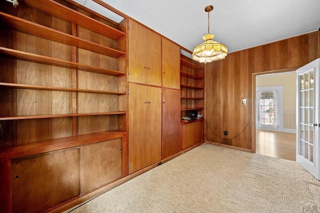 interior space with light colored carpet and french doors