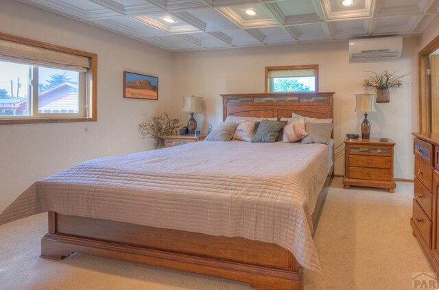 bedroom featuring a wall unit AC, light carpet, coffered ceiling, and recessed lighting