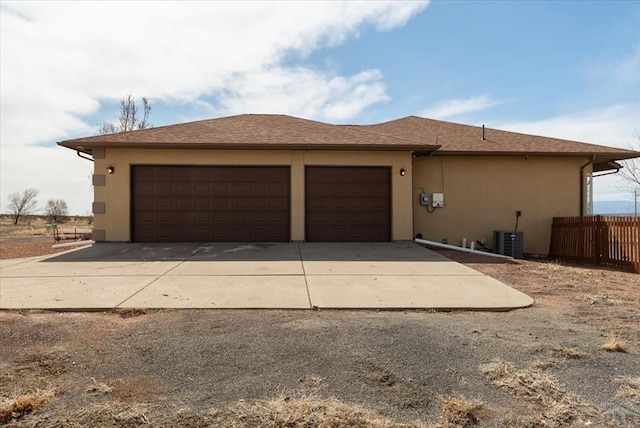 1121 N Calico Rock Ln, Pueblo West, CO 81007 - view of front of home with stucco siding, a garage, and driveway