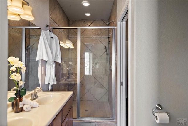 1121 N Calico Rock Ln, Pueblo West, CO 81007 - bathroom with a stall shower and double vanity
