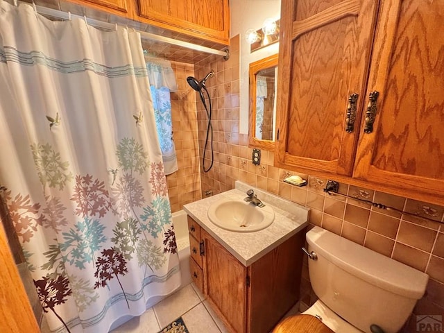 1645 Cherrywood Ln, Pueblo, CO 81005 - full bath with tile walls, vanity, tile patterned floors, decorative backsplash, and shower / tub combo with curtain