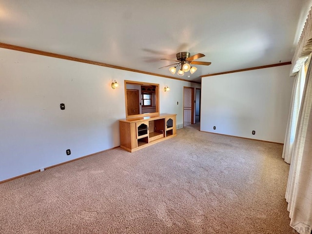 1645 Cherrywood Ln, Pueblo, CO 81005 - unfurnished living room featuring crown molding, a ceiling fan, and light colored carpet