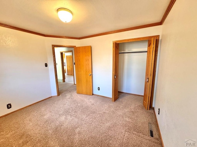 1645 Cherrywood Ln, Pueblo, CO 81005 - unfurnished bedroom featuring carpet, ornamental molding, and a closet