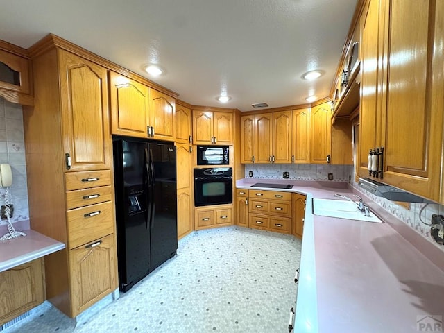 1645 Cherrywood Ln, Pueblo, CO 81005 - kitchen featuring black appliances, brown cabinets, decorative backsplash, light flooring, and light countertops