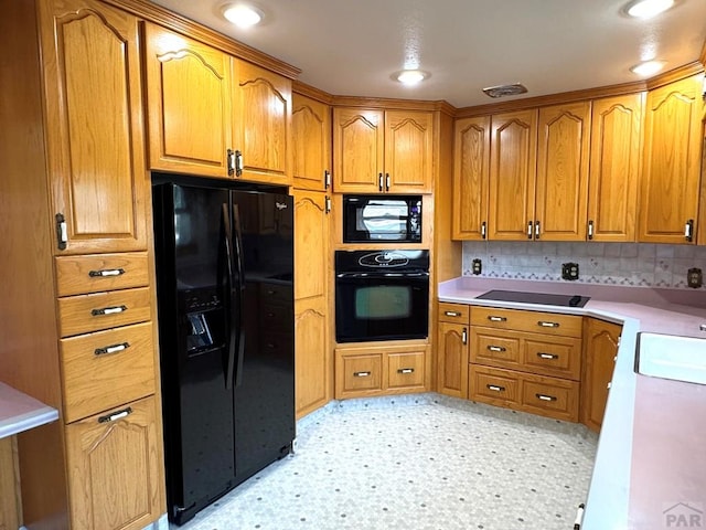 1645 Cherrywood Ln, Pueblo, CO 81005 - kitchen with black appliances, brown cabinetry, light countertops, tasteful backsplash, and light flooring