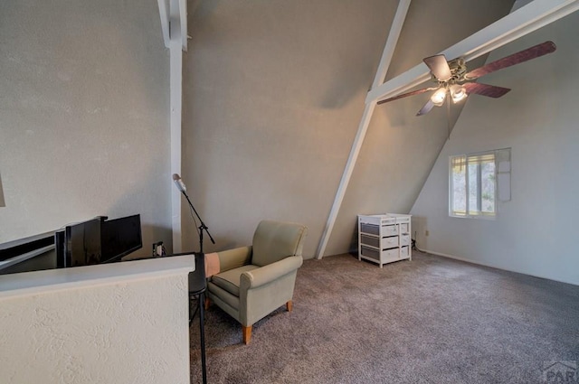 living area with lofted ceiling, ceiling fan, and carpet flooring