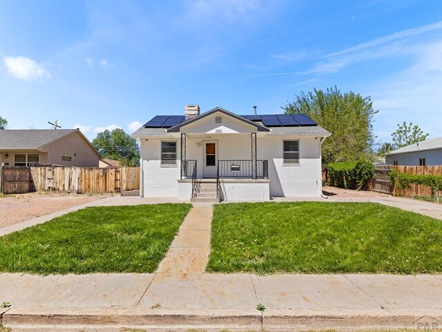 1923 Belmont Ave, Pueblo, CO 81004 - bungalow-style home with solar panels and stucco siding