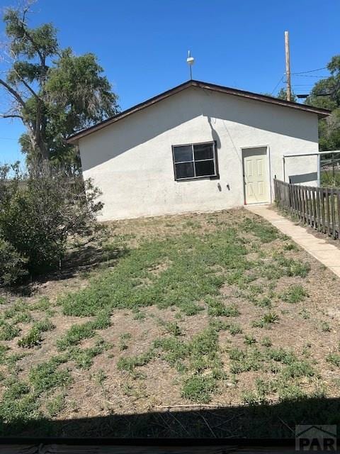 743 Vine Ave, Las Animas, CO 81054 - view of side of property with stucco siding