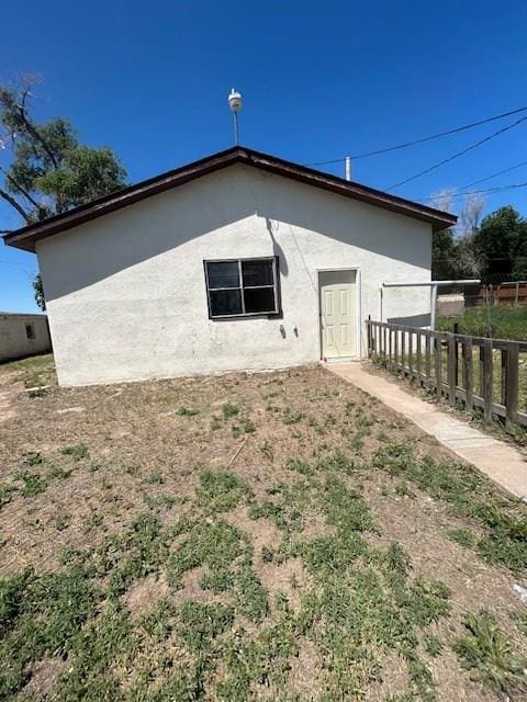 743 Vine Ave, Las Animas, CO 81054 - rear view of property featuring stucco siding