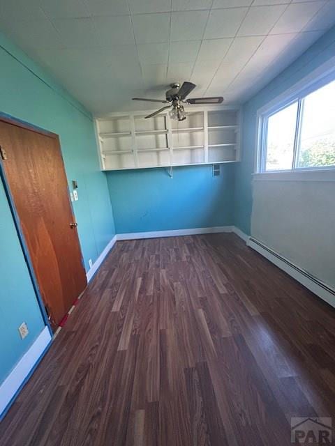 743 Vine Ave, Las Animas, CO 81054 - spare room with a ceiling fan, wood finished floors, baseboards, and a baseboard radiator