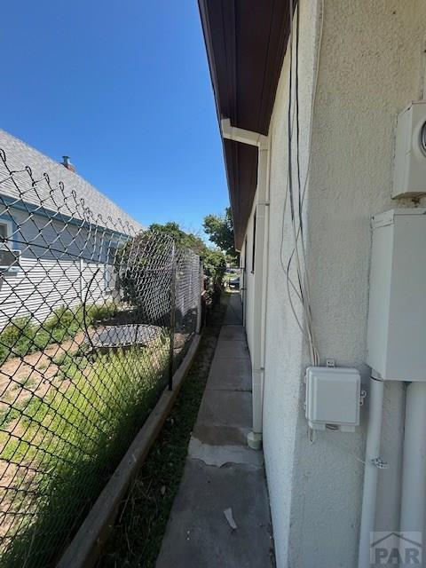 743 Vine Ave, Las Animas, CO 81054 - view of side of home featuring stucco siding
