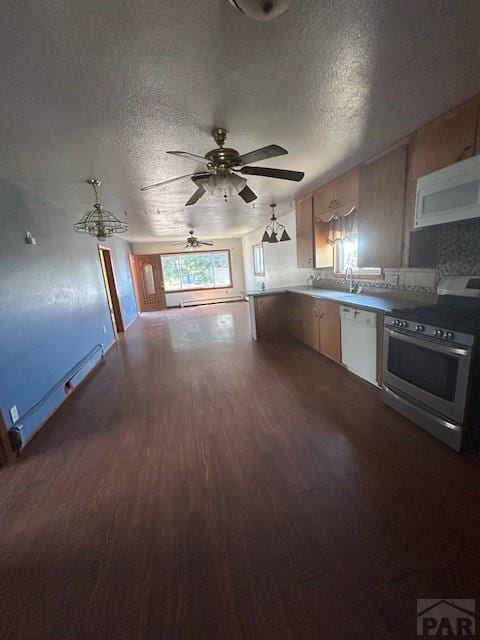 743 Vine Ave, Las Animas, CO 81054 - kitchen featuring stainless steel range oven, dishwasher, dark wood-style flooring, ceiling fan, and a textured ceiling