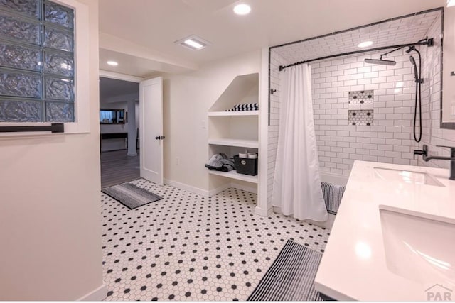 full bathroom with a shower with curtain, baseboards, recessed lighting, and a sink