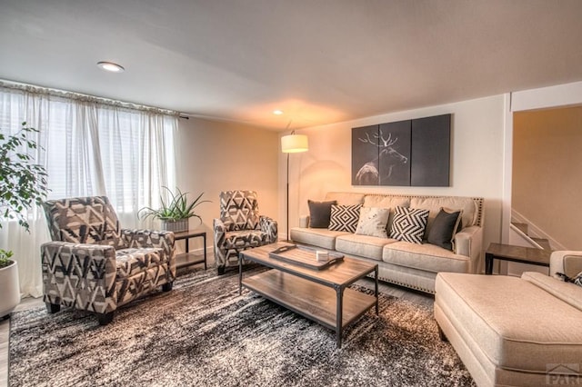 living room with stairs and recessed lighting
