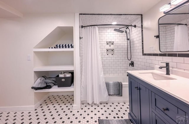 full bath featuring tile walls, shower / bath combination with curtain, and vanity