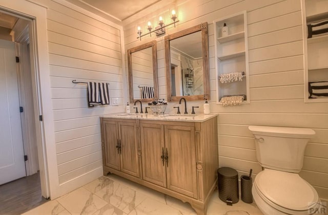 full bathroom with marble finish floor, a sink, and toilet