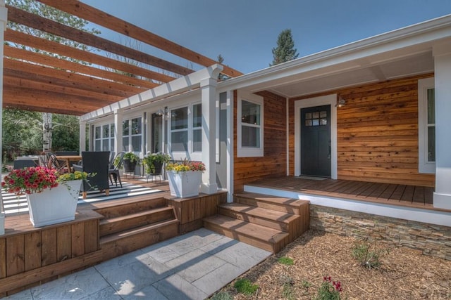 deck with a pergola and outdoor dining space