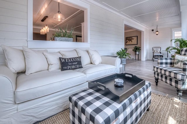 living area featuring wood finished floors and wood walls